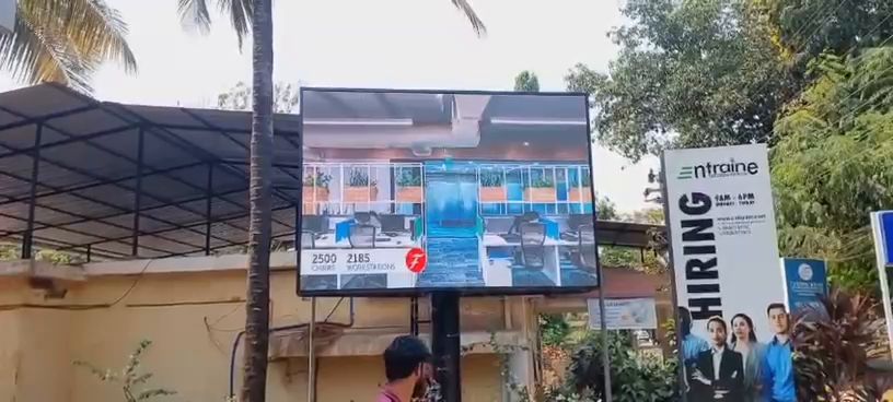 Freestanding outdoor LED screen at an office campus entrance