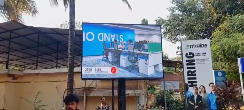 Freestanding outdoor LED screen at an office campus entrance