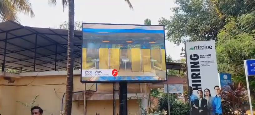 Freestanding outdoor LED screen at an office campus entrance