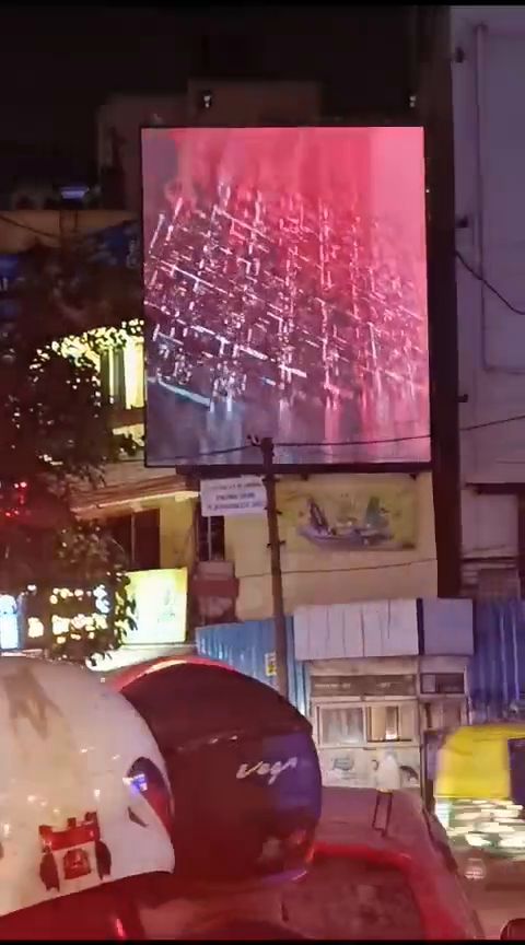 Illuminated LED signage on a shopfront at night