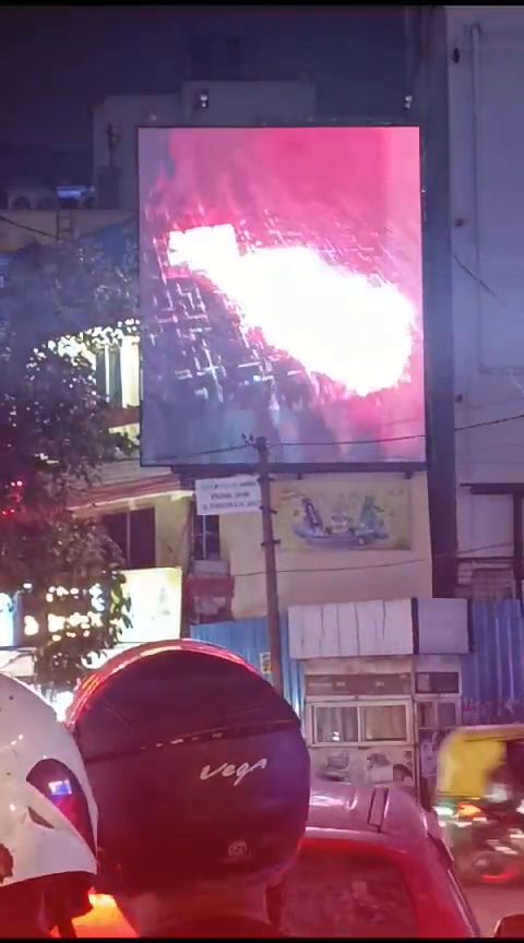 Illuminated LED signage on a shopfront at night