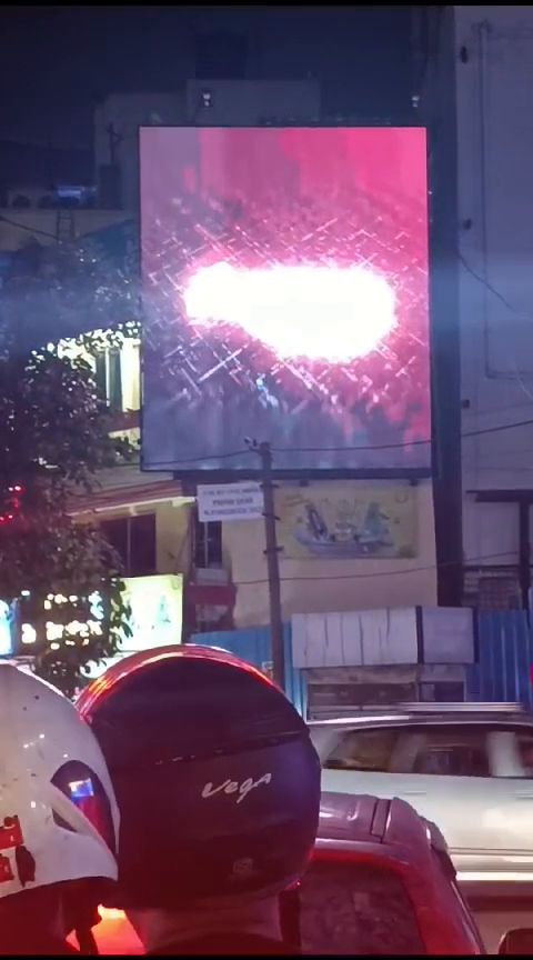 Illuminated LED signage on a shopfront at night