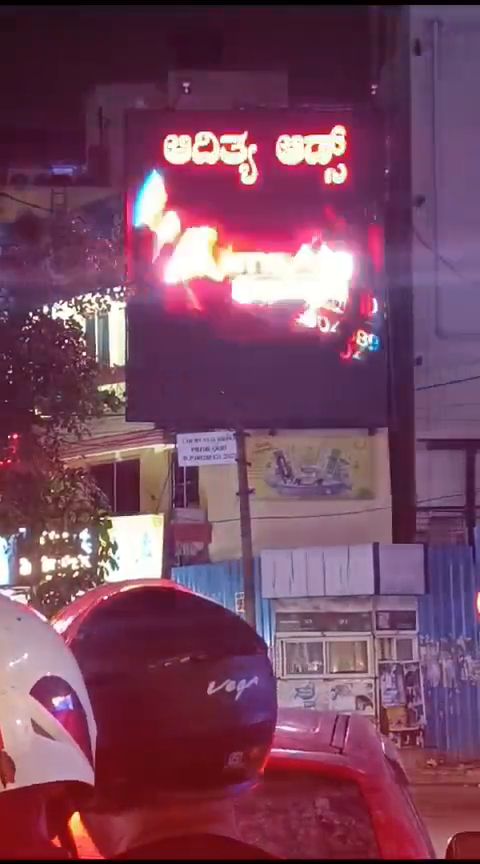 Illuminated LED signage on a shopfront at night