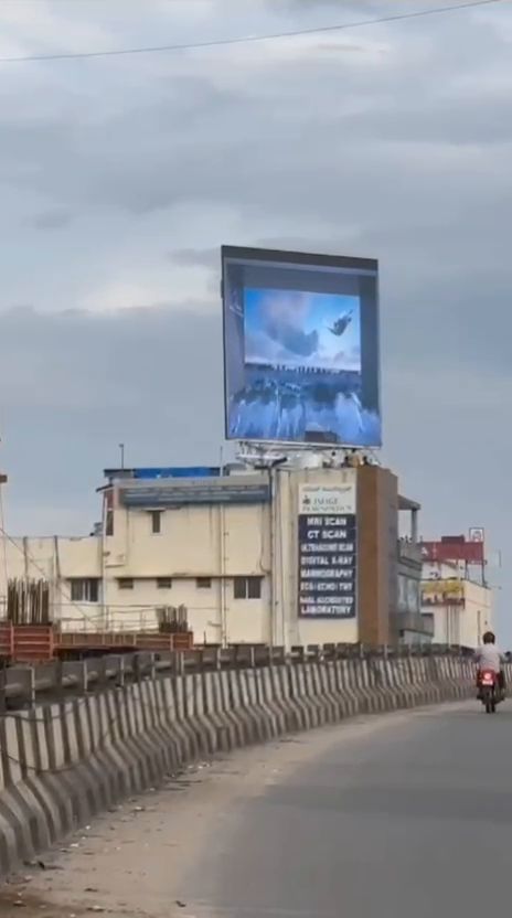 Rooftop LED billboard viewed from an elevated road
