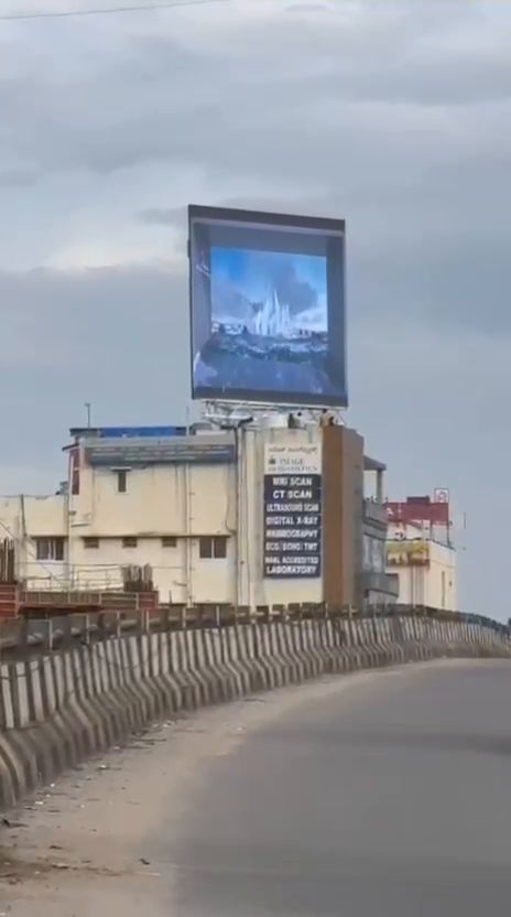 Rooftop LED billboard viewed from an elevated road