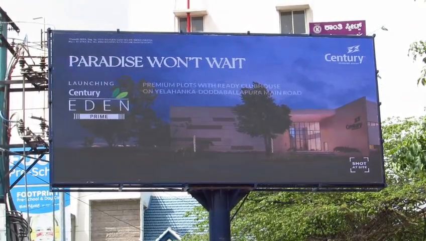 Wide-format outdoor LED billboard beside a road