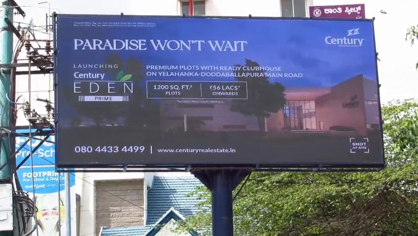 Wide-format outdoor LED billboard beside a road