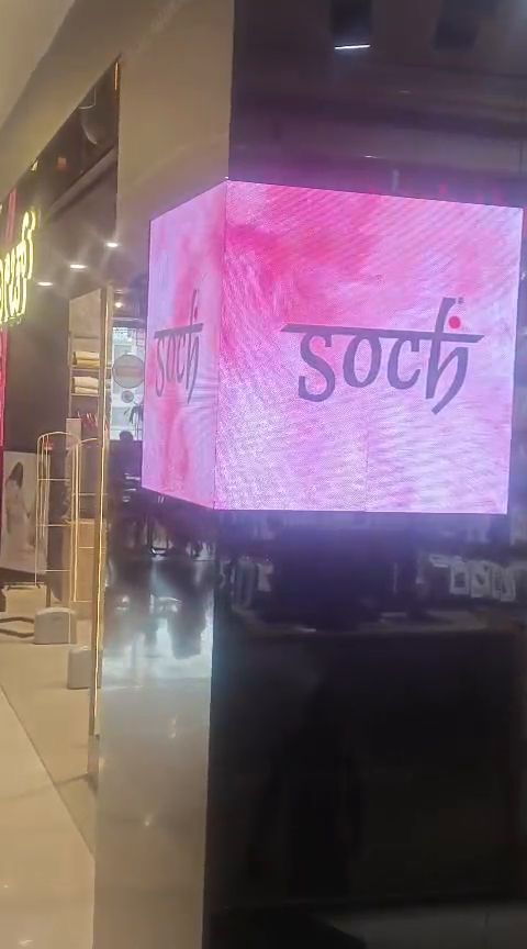 Four-sided indoor LED cube display inside a shopping mall