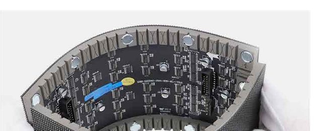 Gloved hands bending a flexible LED module